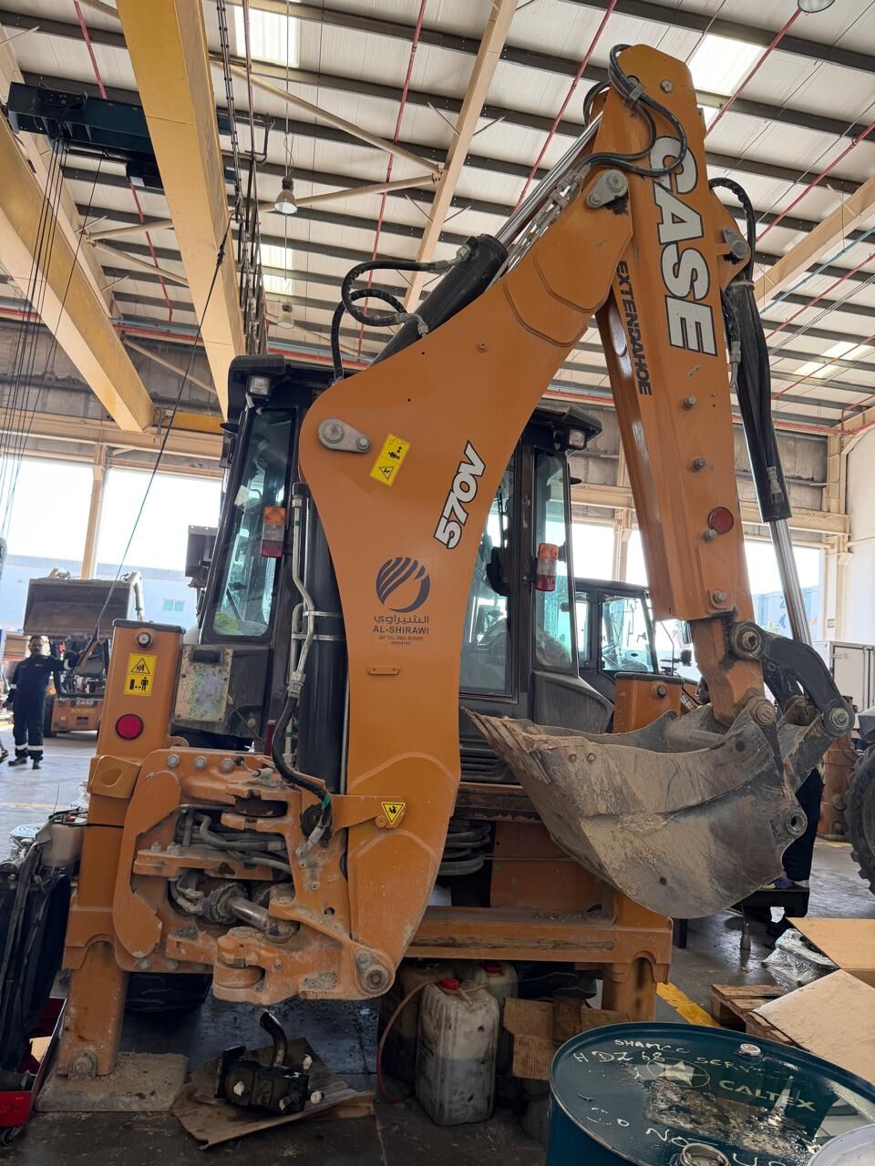 Backhoe loader under survey