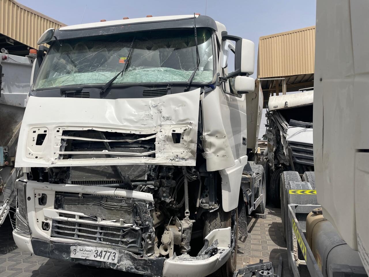 Heavy vehicle with frontal damage under survey